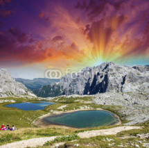 Fototapety Beautiful lakes and peaks of Dolomites. Summer sunset over Alps