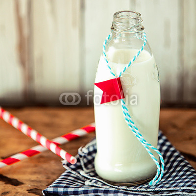 Glass bottle of fresh farm milk
