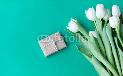 White tulips bouquet and gift box