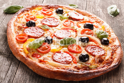 Pizza on wood texture background