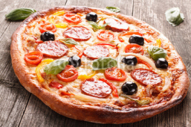 Naklejki Pizza on wood texture background