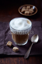 Naklejki Glass of Latte Coffee with Thick Milk Foam