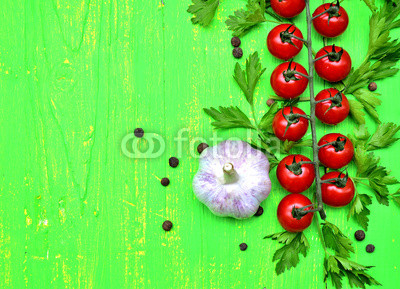 Cherry tomatoes and garlic.Copy space background.