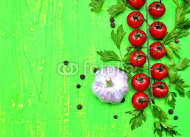 Fototapety Cherry tomatoes and garlic.Copy space background.