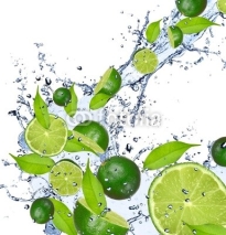 Fototapety Limes falling in water splash, isolated on white background