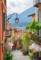 Naklejki Picturesque small town street view in Lake Como Italy