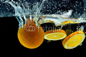 Naklejki Orange Fruit Splash on water