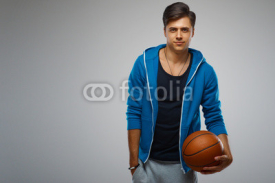 Naklejki Portrait of a young man basketball player