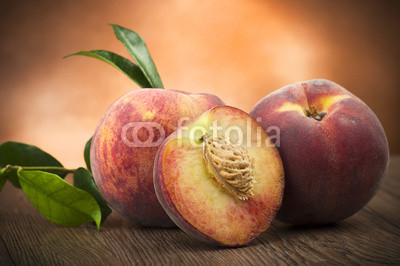 Fresh peach sliced close up on the table