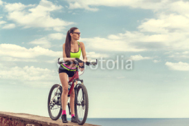 Naklejki A beautiful girl on the bike