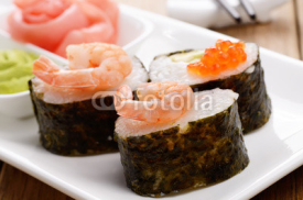 Fototapety Mixed sushi set on a white plate