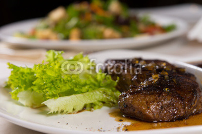 Close Up of Steak on Plate with Garnish