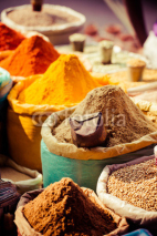 Fototapety Traditional spices and dry fruits in local bazaar in India.