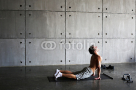 Fototapety Man on the Mat practicing yoga and fitness