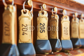Obrazy i plakaty hotel keys with room numbers hanging at reception