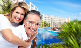 Happy senior couple at tropical resort.