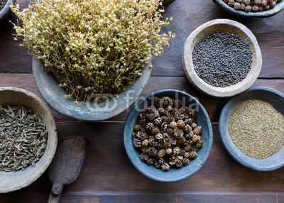 Herbs and spices in bowls used in Ayurvedic medicine