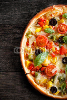 Pizza on wood texture background