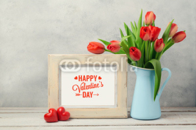 Valentines day concept with tulip flowers and photo frame over rustic background