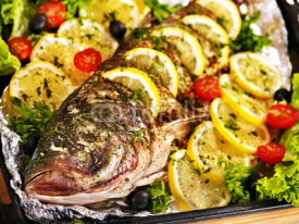 Naklejki Grill fish at oven-tray .