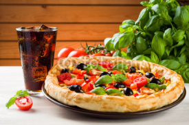 Naklejki Pizza and coke on wooden table