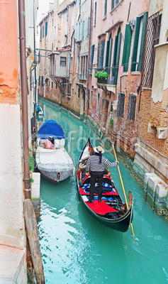 gondola in a narrow canal