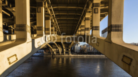 Details of steel bridge and reflection in water of moscow river