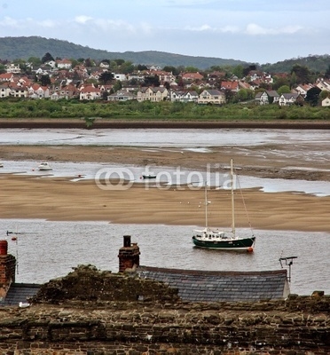 Small town and fishing - boat on low-tide