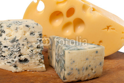 Dorblu and other cheeses on wooden board