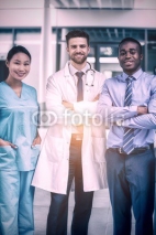 Portrait of nurse and doctor with businessman in hospital