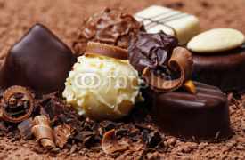 Naklejki a chocolate background with pralines