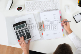Businessperson Calculating Invoice