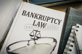 Naklejki Bankruptcy law book. Justice and legislation concept.