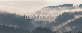 Fototapety Mountain landscape shortly after rain. Clouds of fog
