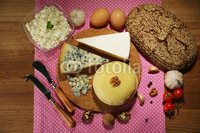 Still life with dairy products and bread on wooden table