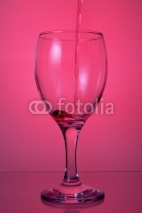 Naklejki pouring wine into a glass