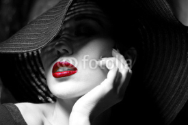 Naklejki Mysterious woman in black hat. Red lips