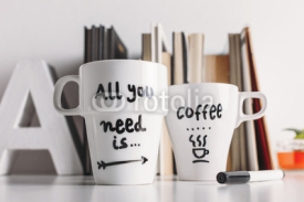 Obrazy i plakaty Close up of two white coffee mug with diy decoration.