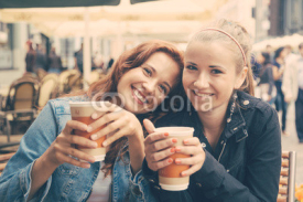 Obrazy i plakaty Teenage Girls Drinking at Bar