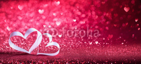 Valentines Day - Ribbon Shaped Hearts On Red Shiny Background

