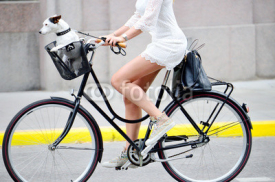 Naklejki Side shot of woman on bike