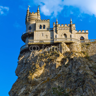Medieval castle agains blue sky with clouds. Swallow's Nest\
