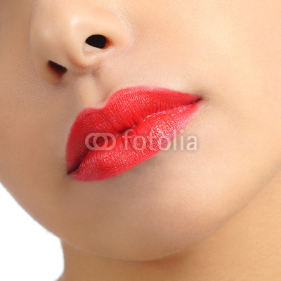 Close up of a woman lips detail painted on red