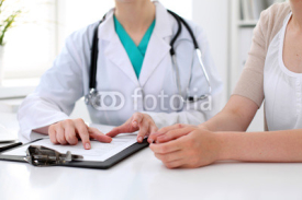 Fototapety Doctor and patient are discussing something, just hands at the table