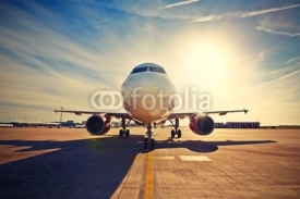 Fototapety Airplane at the sunrise