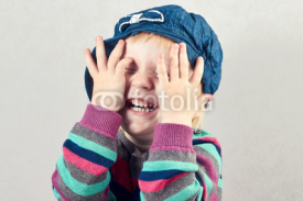 Fototapety Little girl covers  face with her  hands