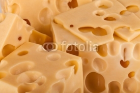 Obrazy i plakaty Background of fresh yellow Swiss cheese with holes