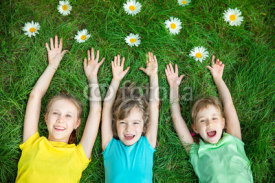 Group of happy children playing outdoors