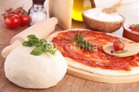 Fototapety pizza dough with tomato sauce and ingredients