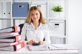 Business woman calculates tax